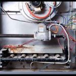 Intricate electrical components inside of a furnace should only ever by handled by a furnace repair Spring Lake professional